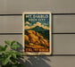 A vintage-style sign for Mount Diablo Rock City in California, featuring a mountain landscape with rocky formations and a cloudy sky.
