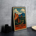 A vintage-style metal sign with a colorful illustration of a mountainous landscape, featuring the words "Garden of the Gods" and "Overlook CO."