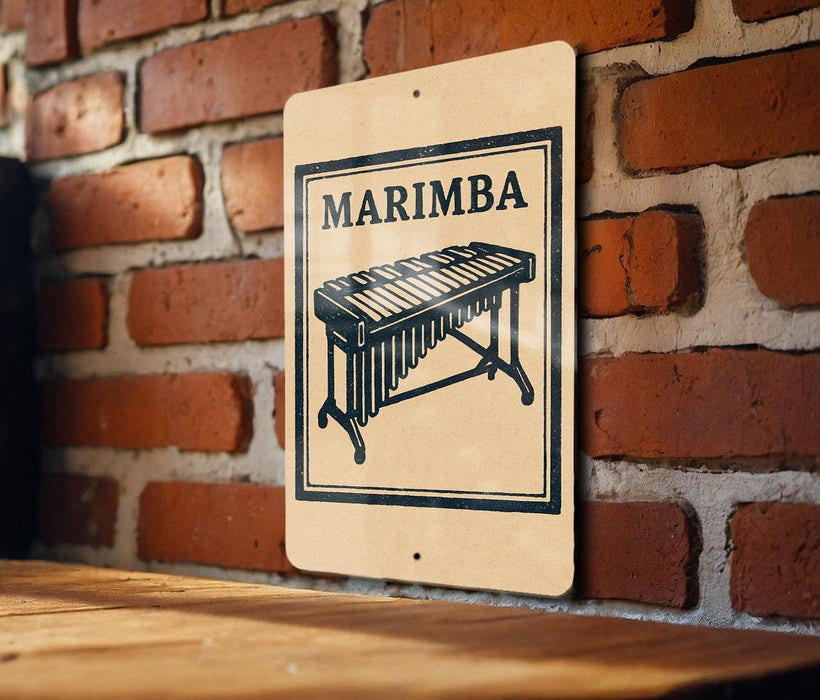 A sign with the word "MARIMBA" and an image of a musical keyboard is displayed on a brick wall.