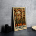 A metal stamp with a picture of the Córdoba Mosque in Spain, featuring arched doorways and columns.