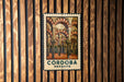 A framed poster of the Córdoba Mosque in Spain, featuring the intricate architecture of the mosque's arches and columns.