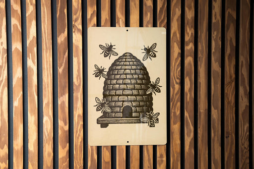 A sign depicting a beehive with bees is mounted on a wooden wall.
