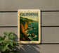 A vintage-style California postage stamp is displayed on a wall, featuring a scenic coastal landscape with cliffs and the ocean.