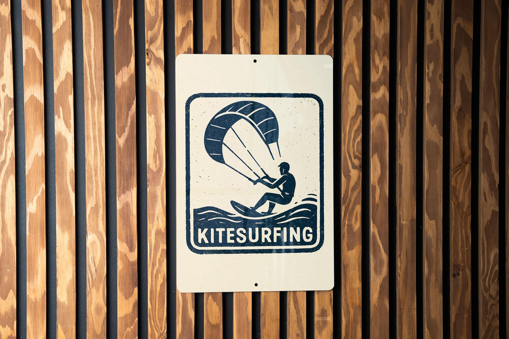 A sign for kitesurfing is displayed on a wooden wall.