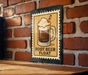 A sign featuring an illustration of a root beer float on a brick wall.