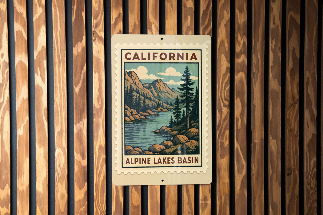 A California postage stamp featuring a scenic landscape with mountains, trees, and a river, mounted on a wooden wall.