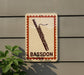 a sign with a bassoon illustration on it, mounted on a wall.