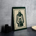 A framed image of a lantern is displayed on a table, accompanied by a stack of black camera lenses and a woven basket.