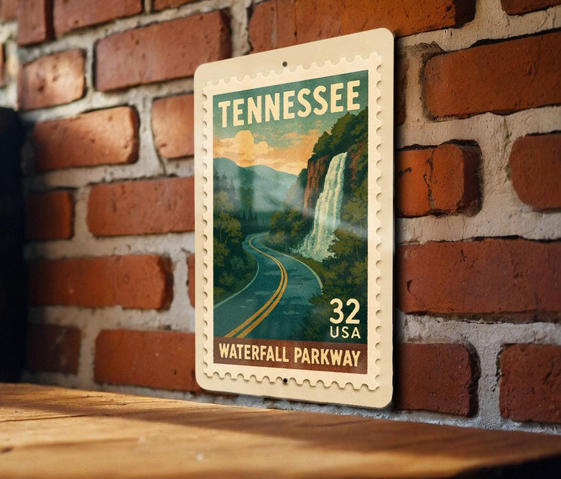 A Tennessee postage stamp depicting a scenic waterfall, mounted on a brick wall.