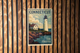 A vintage-style poster of a lighthouse and a house, with the text "Connecticut USA Forever" displayed prominently.