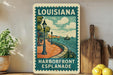 A vintage-style metal sign for Louisiana Harborfront Esplanade, featuring a scenic illustration of a waterfront promenade with lampposts, boats, and a lighthouse.