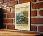 A framed image of a coastal cliff with the text "RING OF KERRY" on the frame is displayed on a brick wall.