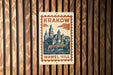 A metal sign with a vintage-style illustration of a castle or palace, mounted on a wooden wall.