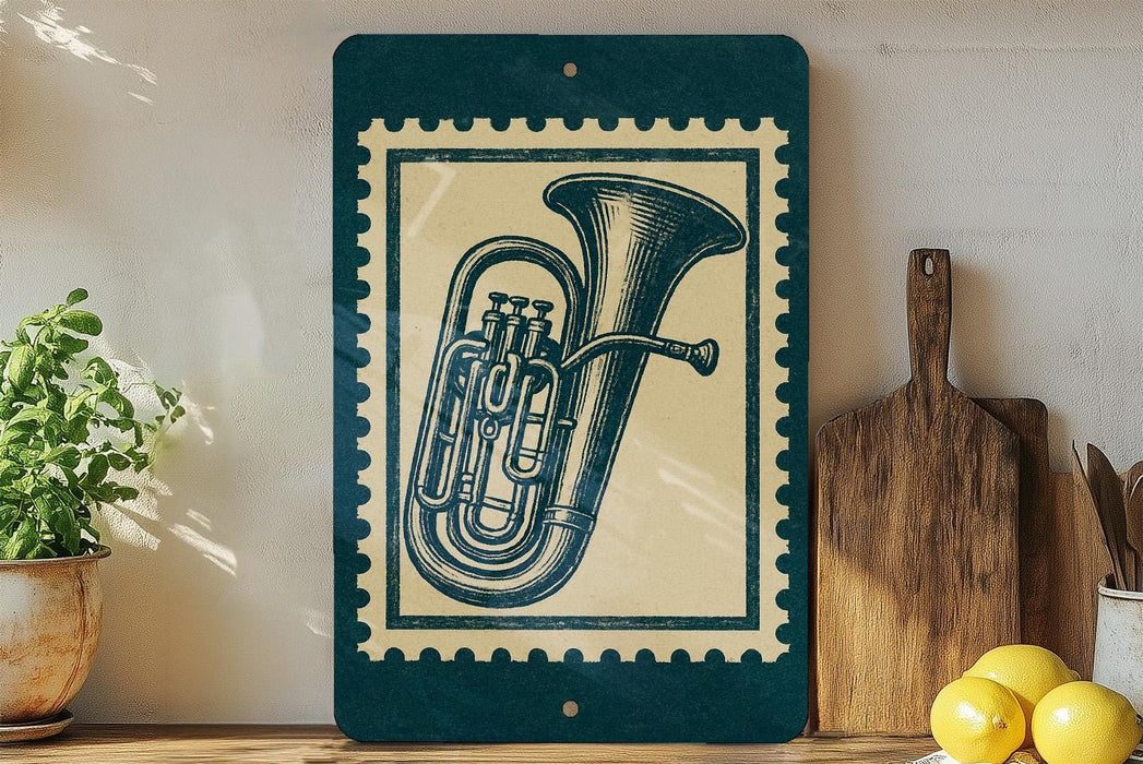 a framed illustration of a tuba on a shelf, with a potted plant to the left and a wooden cutting board to the right.