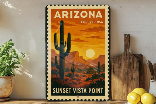 A vintage-style sign for Arizona Forever USA, featuring a desert landscape with a cactus and a sunset, is displayed on a wall next to a wooden cutting board and a potted plant.