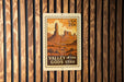 A vintage-style postage stamp depicting the Valley of the Gods in Utah, with the text "USA 20¢" printed on it.