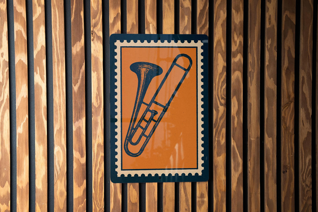 a trombone on a wooden wall.