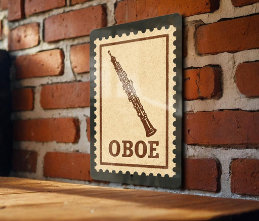 a wooden table with a framed stamp-like sign hanging on the wall, depicting an oboe.
