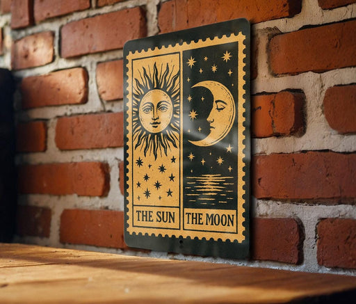 a sign with a sun and moon design, mounted on a brick wall.