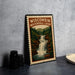 A framed poster of Wisconsin's Waterfall Loop, featuring a scenic illustration of a waterfall surrounded by trees and mountains.