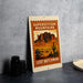 A vintage-style metal sign with a desert mountain landscape and a cactus, featuring the text "SUPERSTITIATION MOUNTAINS LOST DUTCHMAN".