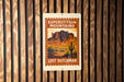 A sign for "Superstition Mountains Lost Dutchman" is displayed on a wooden wall.