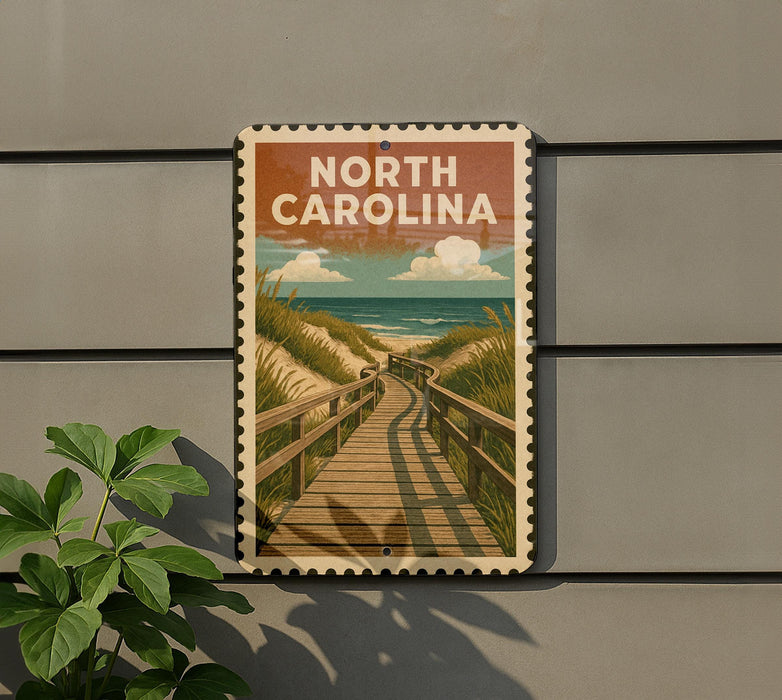 A vintage-style sign that reads "NORTH CAROLINA" is displayed on a wall, featuring a wooden boardwalk leading to a beach scene.