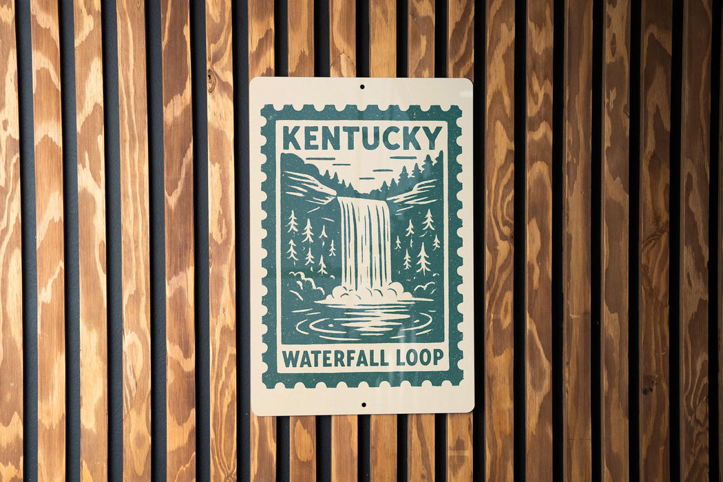 A sign for Kentucky Waterfall Loop is displayed on a wooden wall.