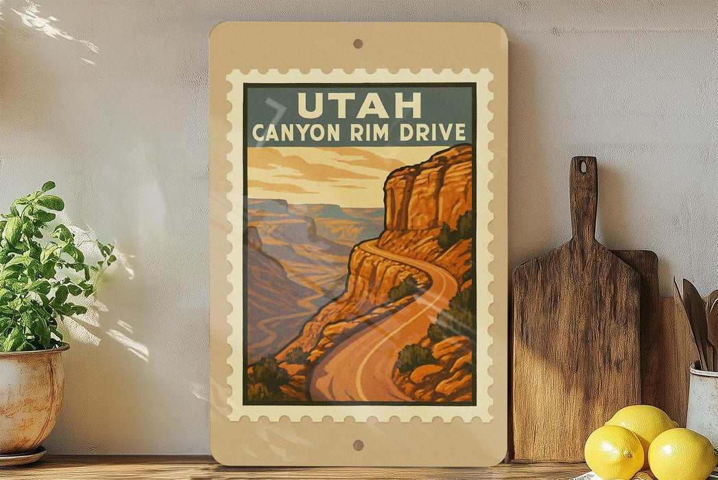 A framed poster of the scenic Utah Canyon Rim Drive, featuring a winding road and a mountainous landscape, is displayed on a shelf next to kitchen utensils and a potted plant.