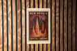 A sign for the Crystal Caves in New Mexico, featuring an illustration of the cave system.