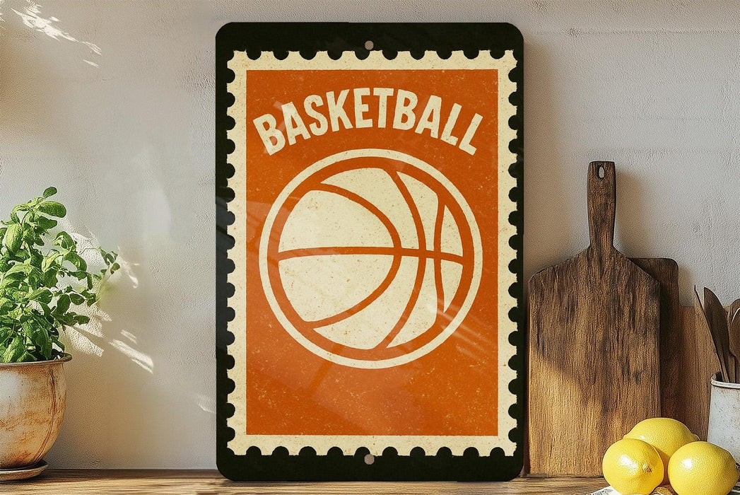 A vintage-style basketball sign with a bold orange and white design is displayed on a shelf, accompanied by a potted plant, a wooden cutting board, and some lemons.