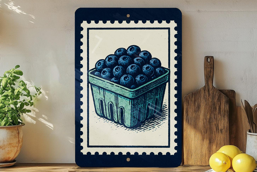 A framed illustration of a blueberry basket on a shelf, with a wooden cutting board and a potted plant to the left.
