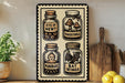 A metal sign with illustrations of four jars containing different items, including a bottle labeled "EYE OF NEWT", a jar labeled "TOADSTOLE", a jar labeled "MANDRAKE", and a jar labeled "BAT WINGS". The sign is displayed on a wooden shelf, with a potted plant and a wooden cutting board visible in the background.