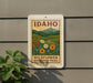 A sign for Idaho's Wildflower Meadows Trail is displayed on a wall, featuring a scenic illustration of a meadow with wildflowers and mountains in the background.