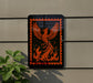 a sign with an orange and black design depicting a phoenix, a mythical bird that rises from the ashes.