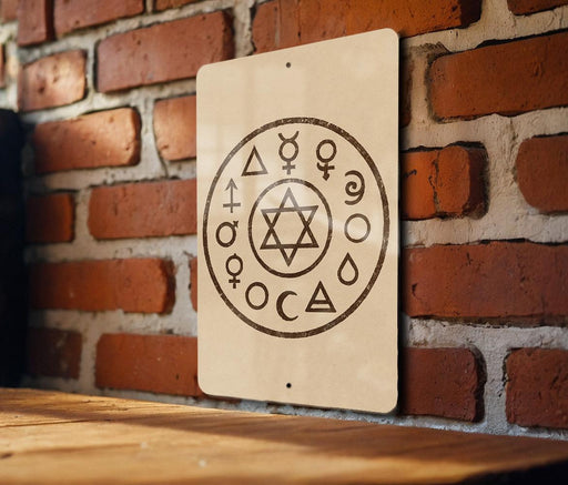 a sign with a circular design on a brick wall.