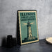 A metal sign with the text "ILLINOIS GREAT LAKES Lighthouses" and an illustration of a lighthouse.