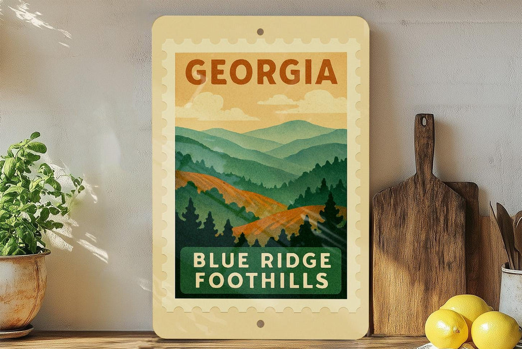 A framed poster of a mountain landscape with the text "GEORGIA" and "BLUE RIDGE FOOTHILLS" displayed on a wall.