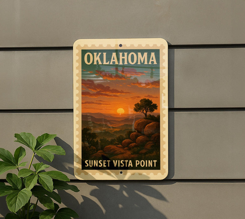 A vintage-style sign for Oklahoma Sunset Vista Point, featuring a scenic landscape with a sunset over a mountain range.