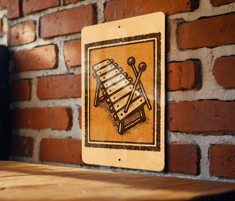 a sign with a musical instrument on it, mounted on a brick wall.