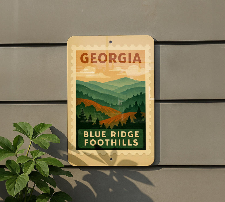 A sign for Blue Ridge Foothills in Georgia, featuring a scenic mountain landscape.