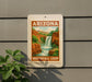 A sign for the Arizona Waterfall Loop, featuring a scenic image of a waterfall surrounded by mountains and lush vegetation.