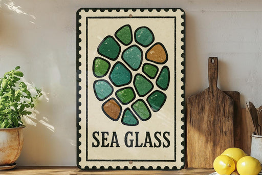 a decorative sign with a sea glass design, placed on a shelf next to a wooden cutting board and some lemons.