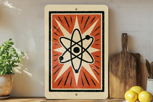 a vintage-style sign with a black and white design, including a stylized atom or molecule, and a wooden cutting board with a lemon on it, placed on a wooden shelf next to a potted plant.
