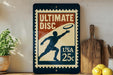 A vintage-style sign advertising Ultimate Disc, featuring a silhouette of a person throwing a frisbee, with a 25c postage stamp price tag.