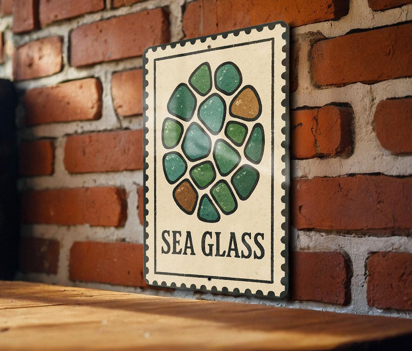 a sign with a circular design of green and brown stones mounted on a brick wall.