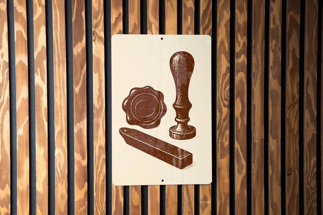 a sign with a vintage-style illustration of a seal, wax seal, and wax stamp, all depicted in brown tones against a wooden background.