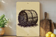 a wooden cutting board, a potted plant, and a sign with a drawing of a hay bale.