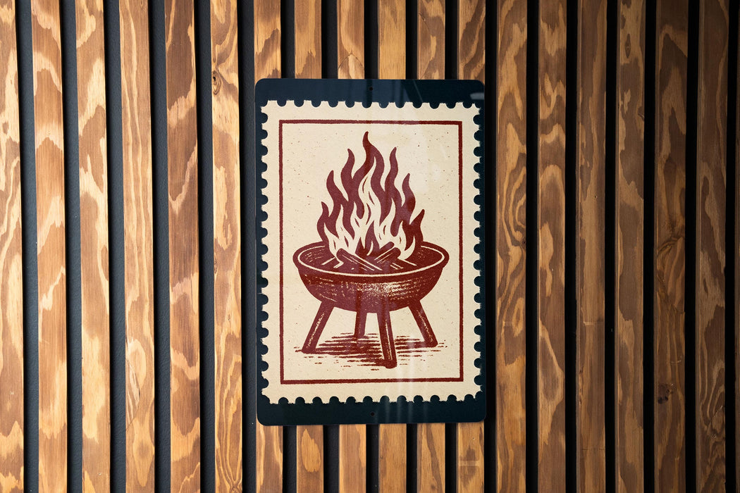 a sign with a red and white design depicting a fire pit or grill.