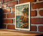 A vintage Maryland postage stamp is displayed on a brick wall, featuring a scenic cliffside landscape with the ocean in the background.
